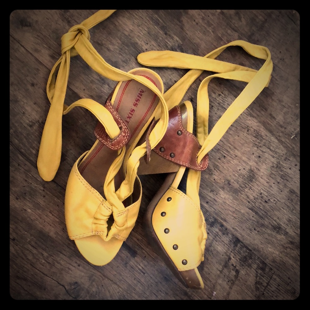 Yellow leather and wood heels